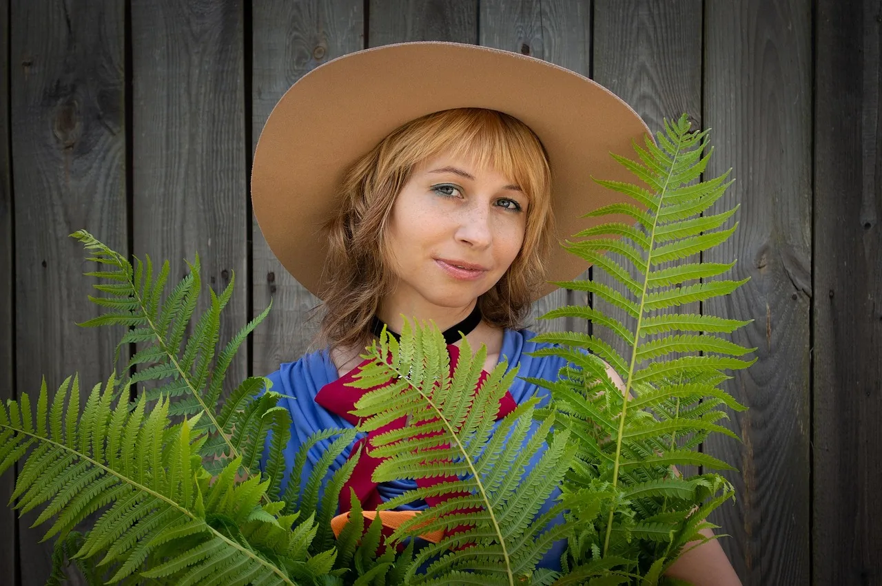 woman, bag, nature, plants, hat, florist, smile, fern, fence, summer, person, young, portrait. How to Start a Florist Business: Setup Steps and a First Seasonal Hire